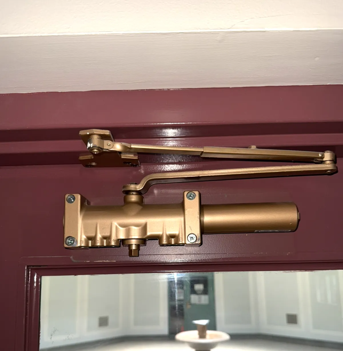 Door Closer Installed And Calibrated On Wall Street Nyc