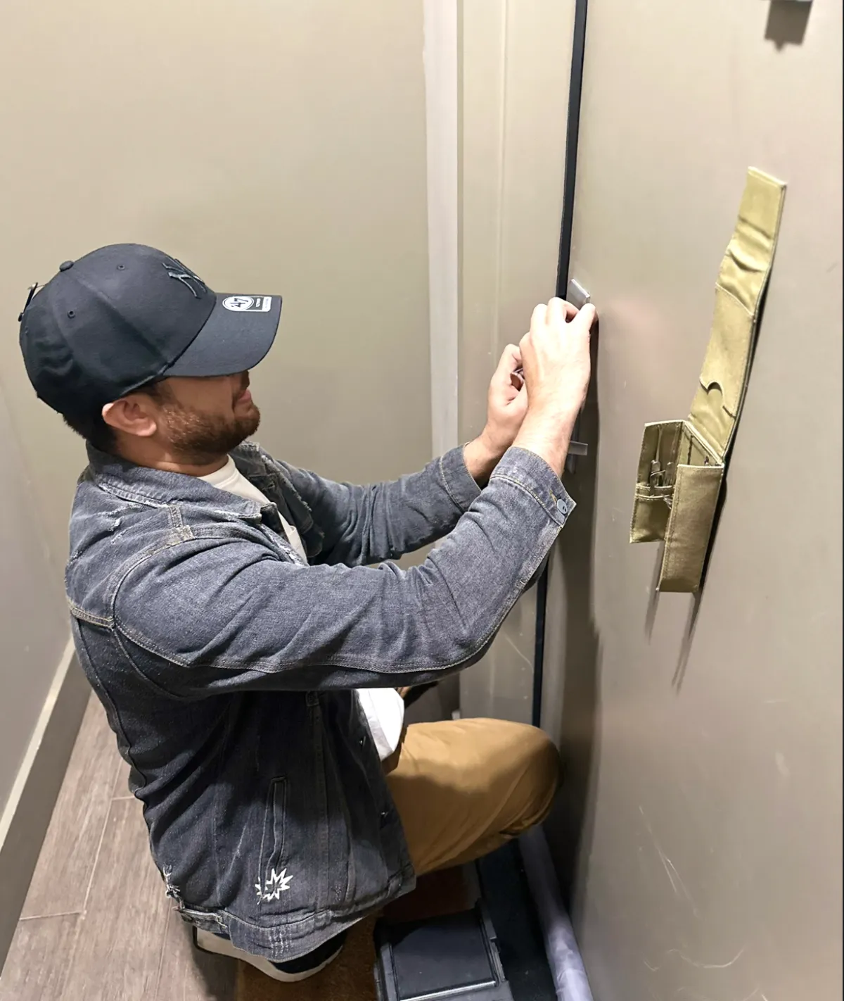 locksmith tech is using lock picking tools